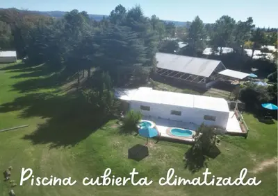 an aerial view of a house with a swimming pool at Club Resort in Mina Clavero