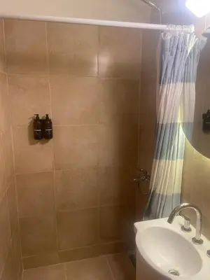 a bathroom with a shower and a sink at Rondeau Apartamento in Cordoba