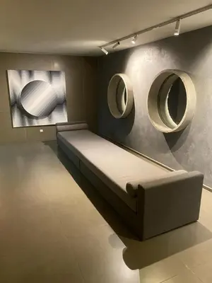 a room with a bed and two mirrors on the wall at Departamento -Cata- Pleno General Paz, cerca de Sanatorios, Terminal de omnibus y Nueva Cordoba, BY Apartcba in Cordoba