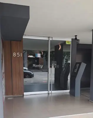 a glass door of a building with a car in the window at Departamento -Cata- Pleno General Paz, cerca de Sanatorios, Terminal de omnibus y Nueva Cordoba, BY Apartcba in Cordoba