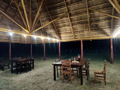 a group of tables and chairs in a tent at Cabañas Alisha in Panaholma