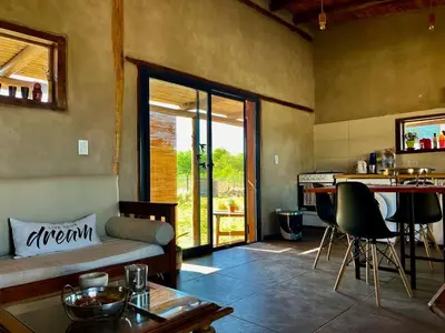 a living room with a couch and a table at La adorable in Los Reartes