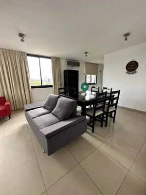 a living room with a couch and a table at Depto Sorrento céntrico in Villa Carlos Paz
