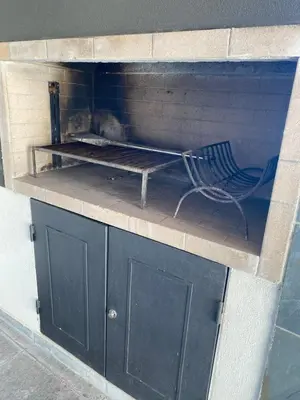 a bench sitting on top of a brick oven at MD Amoblado Córdoba Capital in Cordoba