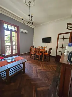 a living room with a table and a dining room at CASONA REAL in Cordoba