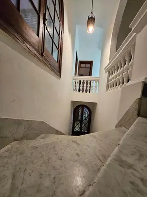 a bedroom with a staircase and a window in a building at CASONA REAL in Cordoba