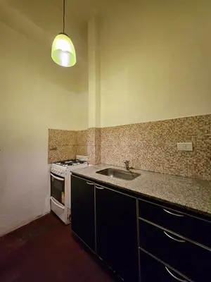 a kitchen with a sink and a stove at CASONA REAL in Cordoba