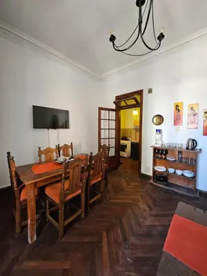 a dining room with a wooden table and chairs at CASONA REAL in Cordoba