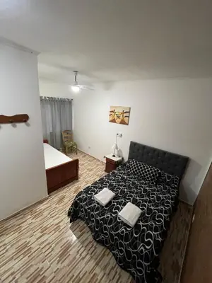a bedroom with a bed with two pillows on it at Santa Martina in Merlo