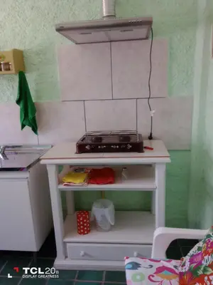 a toy kitchen with a stove on a table at Hospedaje LA LUCIA in Almafuerte