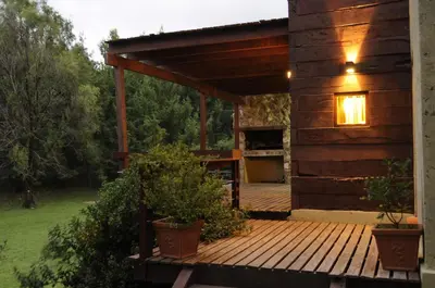 a porch of a cabin with a wooden deck at Niderost in Villa Berna