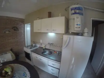 a small kitchen with a sink and a refrigerator at Granate in Villa Cura Brochero
