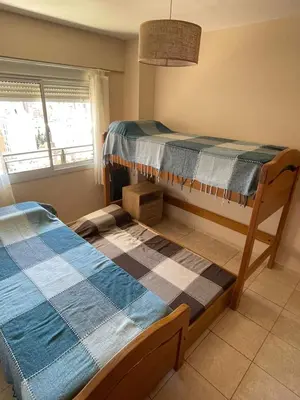 a bedroom with two bunk beds and a window at Bv San Juan - Nva Cba in Cordoba