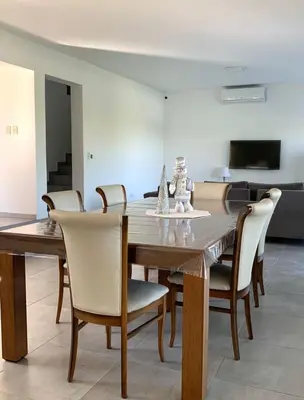 a dining room with a wooden table and chairs at Tierra Alta, Comarca Serrana in Cordoba