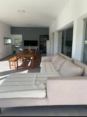 a living room with a white couch and a table at Tierra Alta, Comarca Serrana in Cordoba