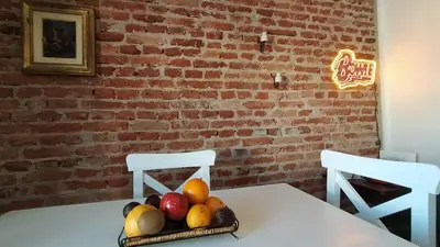a table with a bowl of fruit on top of it at El depto de Bowie in Santa Rosa de Calamuchita