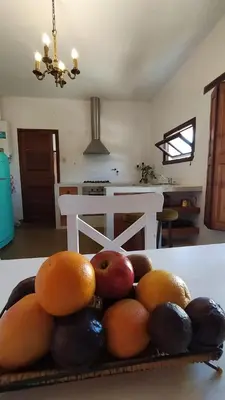 a pile of fruit on a table in a kitchen at El depto de Bowie in Santa Rosa de Calamuchita