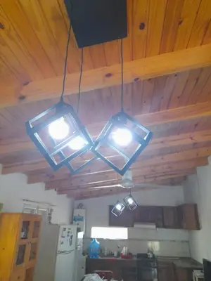 two lights hanging from a ceiling in a kitchen at rafaella in Villa Anizacate