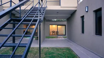 a staircase leading to the entrance of a building at Complejo Giraluna in Almafuerte