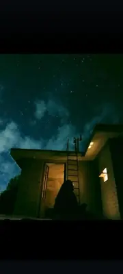 a silhouette of a person standing outside a house at night at Casa de adobe Cuesta blanca in Cordoba