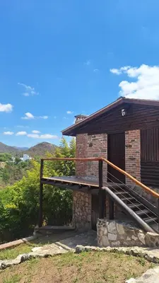 a brick building with a staircase next to it at Balcón de Los Aromos in La Bolsa