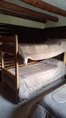 two bunk beds in a room withthritisthritisthritisbestosbestosbestosbestosbestosbestos at Balcón de Los Aromos in La Bolsa