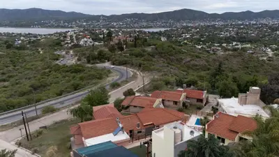 an aerial view of a city and a road at Cabañas La Ernestina in Villa Carlos Paz