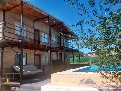 a house with a pool in front of it at La Posada De Vito in Cordoba