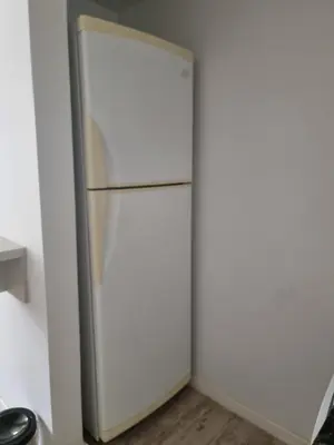 a refrigerator in a room with white walls at Dpto en Planta Baja Cba Cap con seguridad in Cordoba