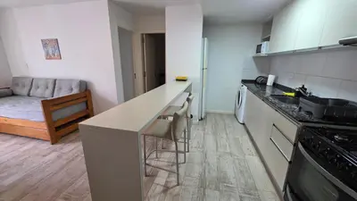 a kitchen with a counter and a stove top oven at Dpto en Planta Baja Cba Cap con seguridad in Cordoba