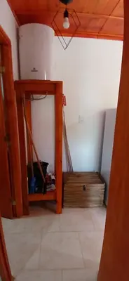 a room with a mirror and a staircase in a house at Cabaña Claro de Luna in Merlo