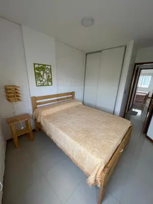 a bedroom with a large bed in a room at VENECIA céntrico con balcón in Villa Carlos Paz