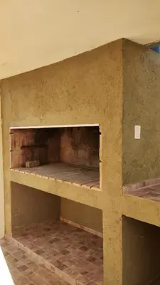 a room with a wall with a shelf in it at El Roble, casa de sierra in Estancia Vieja