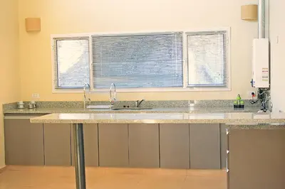 a kitchen with a sink and a window at Ayllupelli in Villa Berna