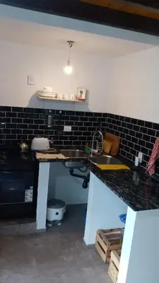 a kitchen with a sink and a counter top at 