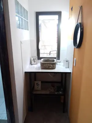 a bathroom with a sink and a window at 