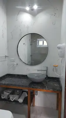a bathroom with a sink and a mirror at Raíces serranas in Villa de Las Rosas
