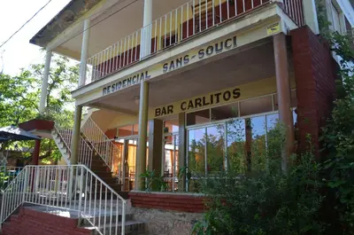 a building with a sign that reads bar galleries at Hosteria Sans Souci in Tanti