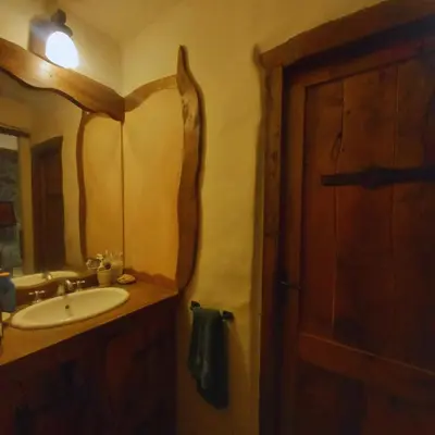 a bathroom with a sink and a mirror at La Calandria in Los Hornillos