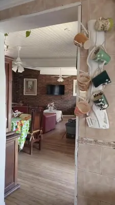 a room with a living room with a dining room at Gracias Viejo in Merlo