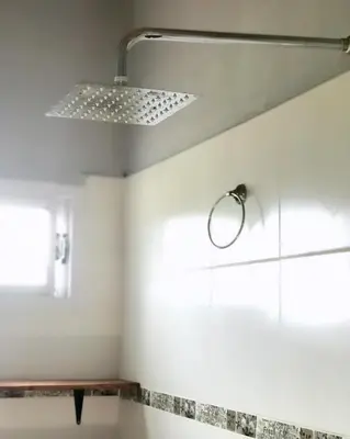 a bathroom with a shower and a window at El CAMPITO in La Ramada