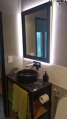 a bathroom with a sink and a mirror at Departamento Zona Norte, Kempes, Allende Cerro in Cordoba