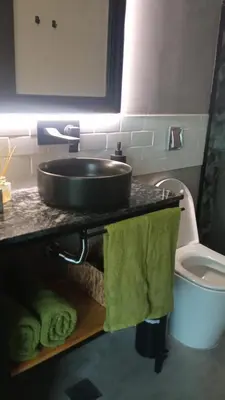 a bathroom with a sink and a toilet at Departamento Zona Norte, Kempes, Allende Cerro in Cordoba