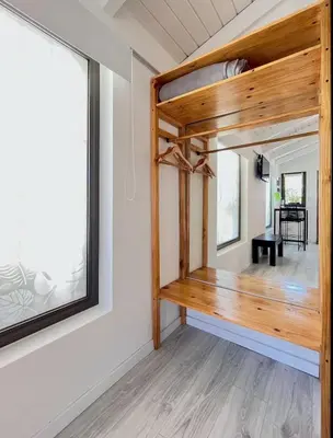 a room with a wooden staircase in a house at Departamento Zona Norte, Kempes, Allende Cerro in Cordoba