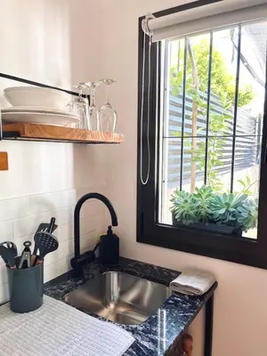 a kitchen counter with a sink and a window at Departamento Zona Norte, Kempes, Allende Cerro in Cordoba