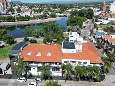 an aerial view of a building with an orange roof at Hotel El Condado in Villa Carlos Paz
