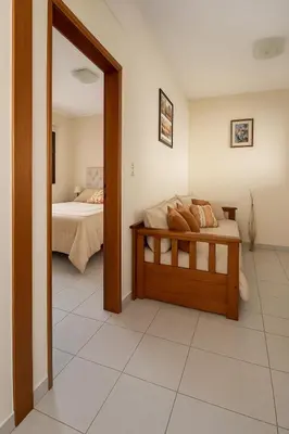 a bedroom with a bed and a mirror at Departamento 