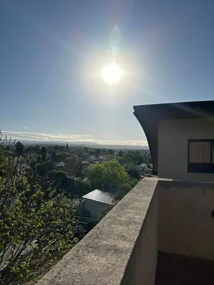 a view from a building with the sun in the sky at Departamento 