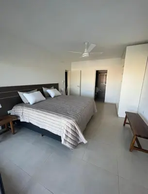 a bedroom with a large bed with a ceiling at Casaabril in Villa Carlos Paz