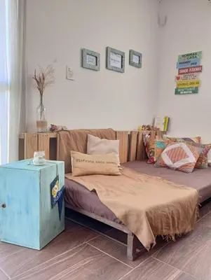 a large bed in a room with a couch at La Tacuarita in Estancia Vieja